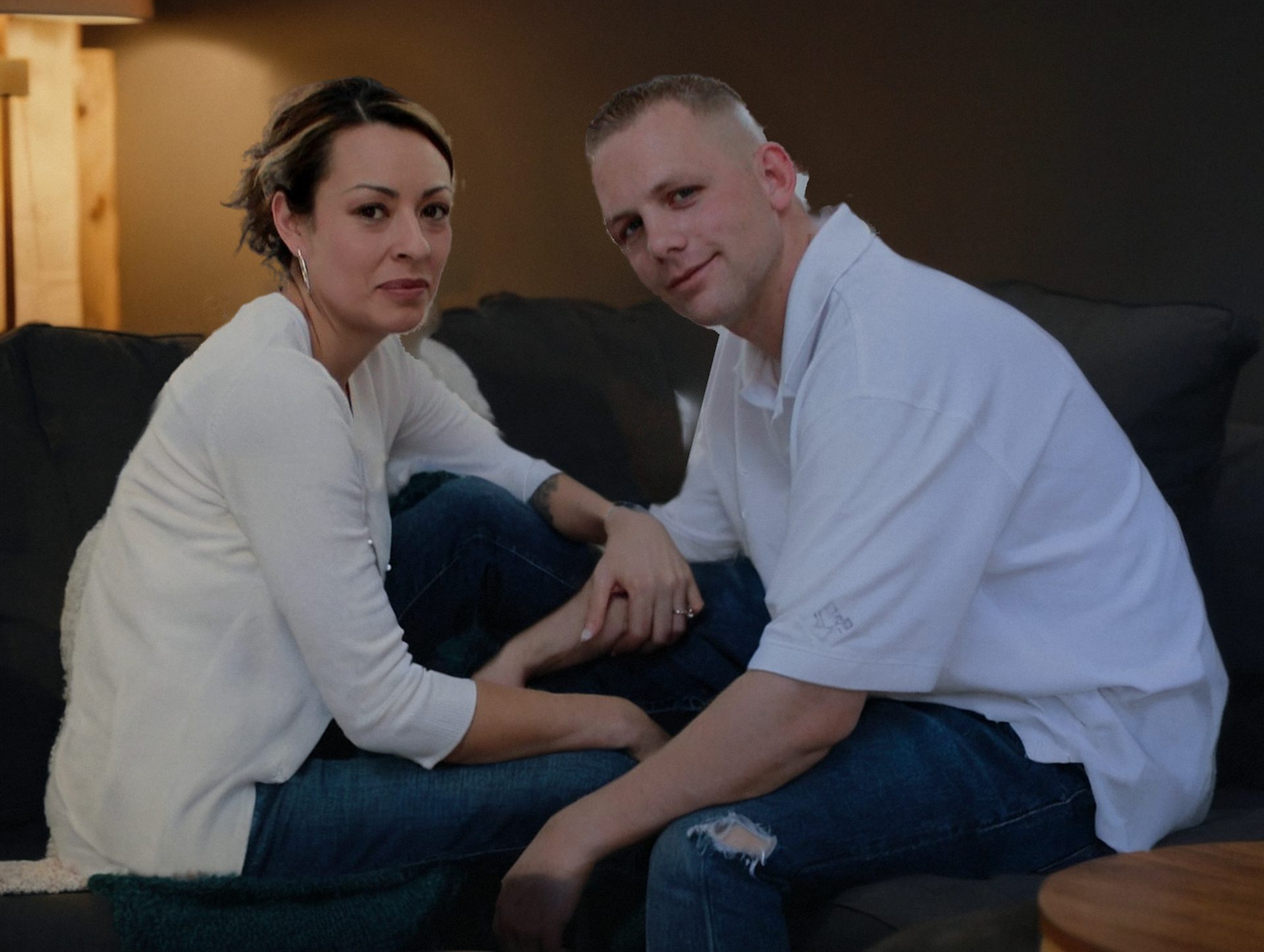 A couple relaxing together on the sofa at home